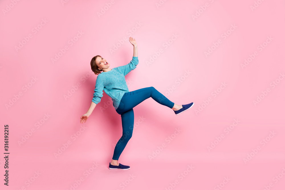 Full length body size view of her she nice attractive lovely funky cheerful cheery clumsy brown-haired woman having fun fooling isolated over pink pastel color background