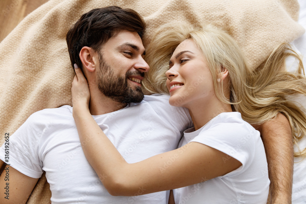 Happy together. Love. Fun. Emotions. Young couple are hugging and laughing Happy together. Love. Fun. Emotions. Young couple are hugging and laughing