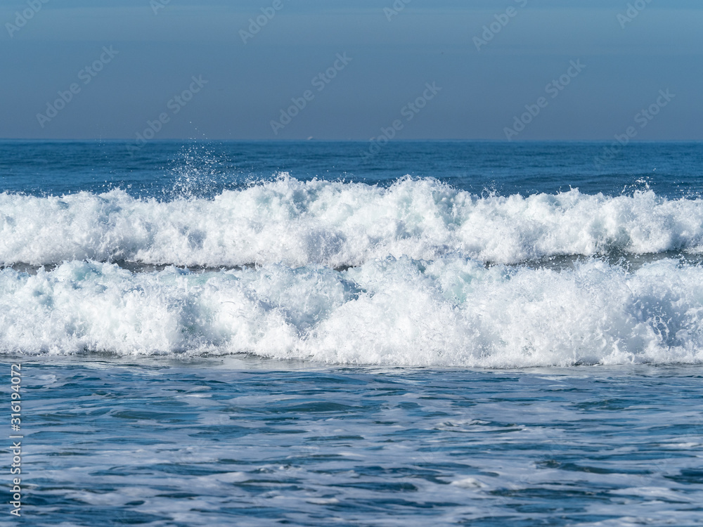 Fototapeta premium Waves breaking on Sopelana beach in Bilbao.