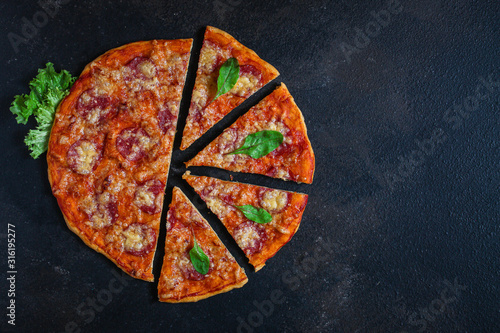 pizza sausages (tomato sauce, cheese, meat). food background. top view. copy space