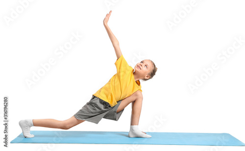 Little girl practicing yoga...