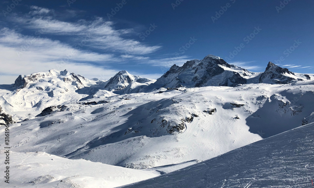 Obraz premium panorama Zermatt small Matterhorn theodul glacier gornergrat view mountain winter snow landscape Swiss Alps clouds