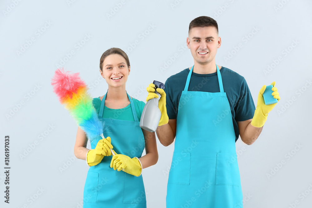 Portrait of janitors on light background Portrait of janitors on light background