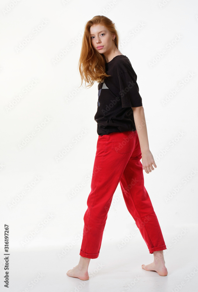 young girl with loose long red hair on a white background young girl with loose long red hair on a white background
