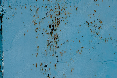 Cracked blue painted metal texture backgraund photo