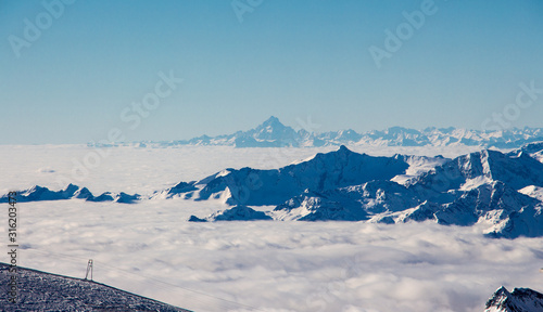 Zermatt Breuil cervinia sea of clouds in valley mountains emerging view perfect sky photo