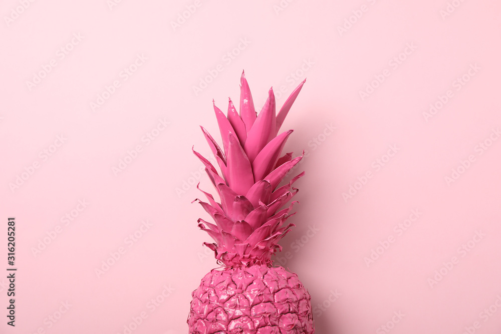 Fototapeta Painted pink pineapple on color background, space for text