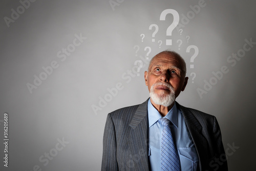Wallpaper Mural Old man and question marks. Dementia and ignorance. Confused old man. Torontodigital.ca