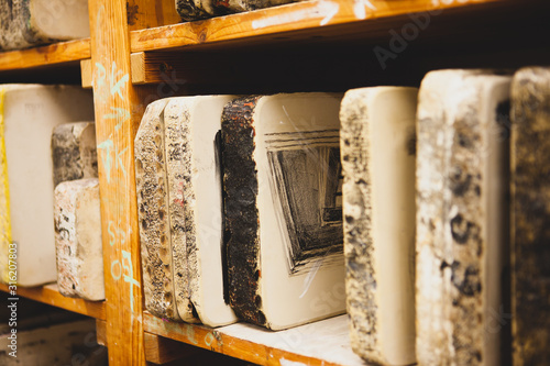 Quadro em tela In the workshop for lithography.  Lithography stone on shelf