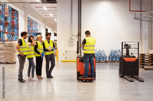 Training on a forklift, managers and workers