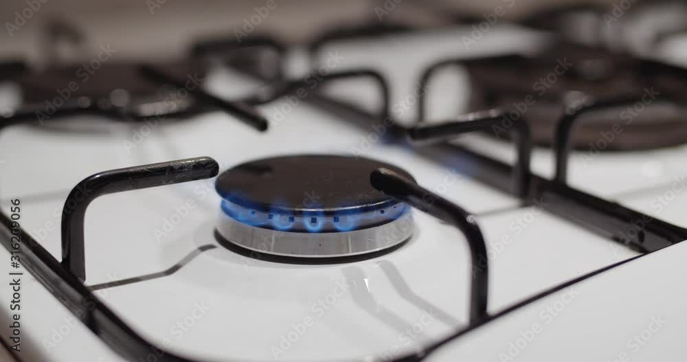 Ignition of gas stove, slowmo closeup Ignition of gas stove, slowmo closeup