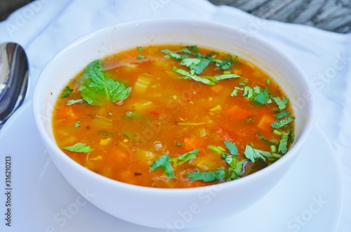 A bowl of hot and sour vegetable soup at an Indian restaurant