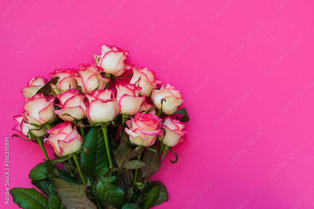 Bouquet of fresh pink roses on magenta background. Top view. Flat lay. Copy space. Valentines day, mothers day or birthday celebration concept Bouquet of fresh pink roses on magenta background. Top view. Flat lay. Copy space. Valentines day, mothers day or birthday celebration concept