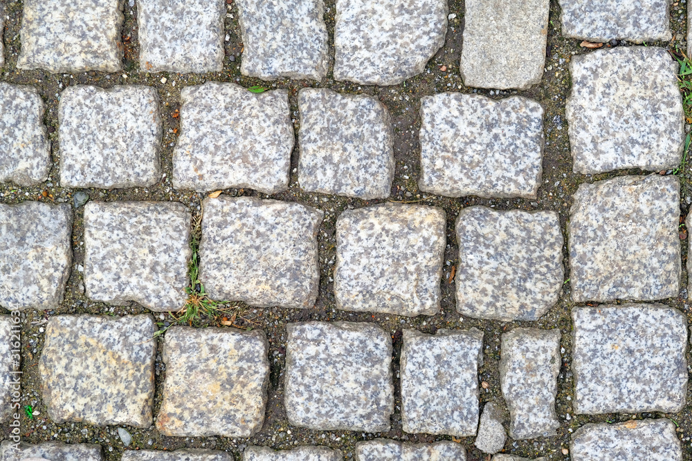 Texture of old Cobbled Pavement close-up. Abstract Granite Background.. Texture of old Cobbled Pavement close-up. Abstract Granite Background..