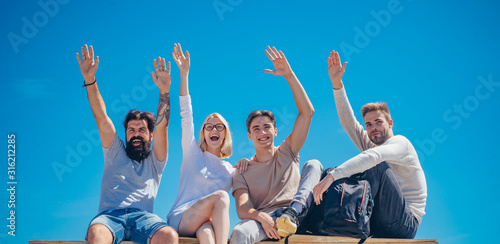 Group of close friends smiling looking very happy. Friendship relations. Business team. Cheerful smiling happy best friends walking outdoor together and having great time. Natural background.