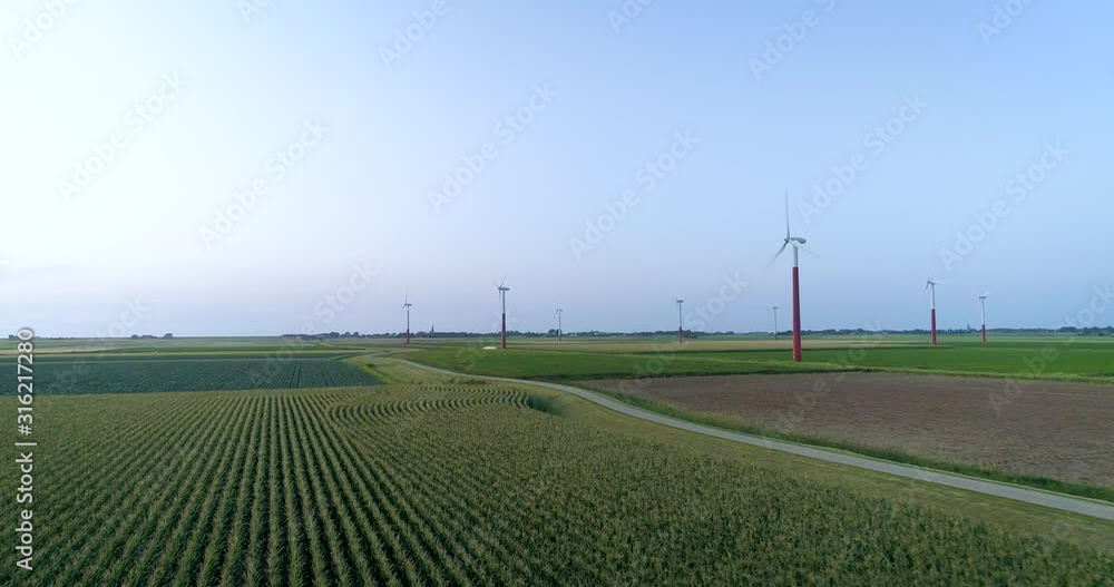 Turbines on a Wind Farm Producing Renewable Green Energy, Flying Low Over a Field with Crops - Barradeel, Friesland, The Netherlands – 4K Drone Footage Turbines on a Wind Farm Producing Renewable Green Energy, Flying Low Over a Field with Crops - Barradeel, Friesland, The Netherlands – 4K Drone Footage