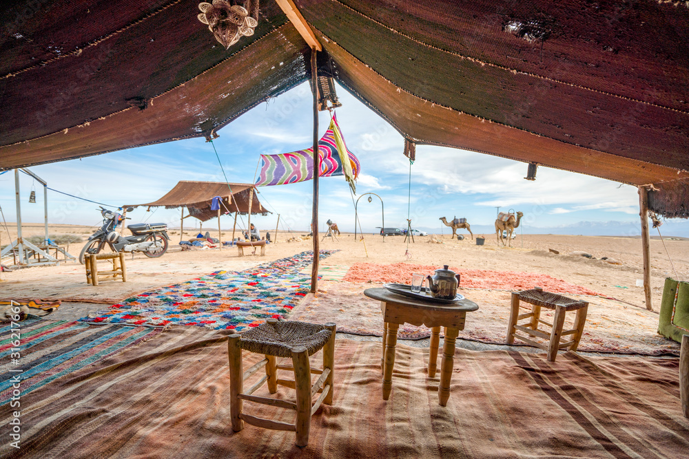 Interior of Bedoiun temporary stretch tent on Agafay desert, Morocco - obrazy, fototapety, plakaty 