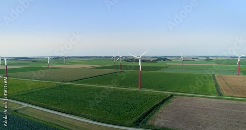 Cinematic Turning Shot of Turbines on a Wind Farm Producing Renewable Green Energy - Barradeel, Friesland, The Netherlands – 4K Drone Footage photo