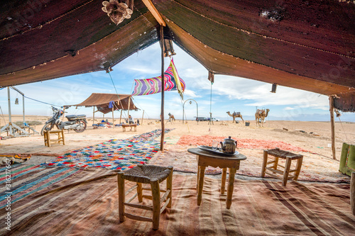 Interior of Bedoiun temporary stretch tent on Agafay desert, Morocco photo
