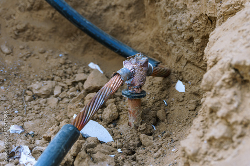 Close up copper electric ground rod.grounded disconnect electrical current that leaks into the ground without causing ashort. photo