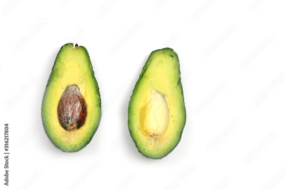 cut avocado isolated on white background. Horizontal image. Flat lay cut avocado isolated on white background. Horizontal image. Flat lay