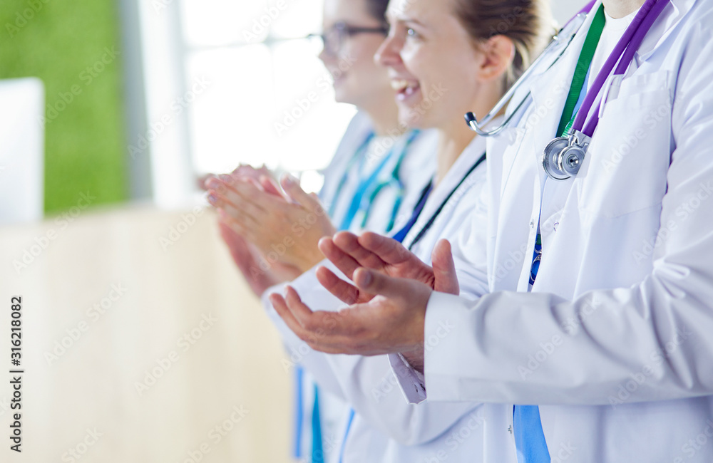 Medical team clapping their hands during a meeting Medical team clapping their hands during a meeting