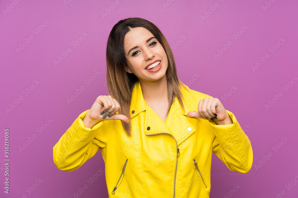 Young woman over purple background proud and self-satisfied Young woman over purple background proud and self-satisfied