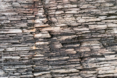 Rough texture pattern of the old black and white grunge stone surface, Strong structure durable nature of rock for abstract background