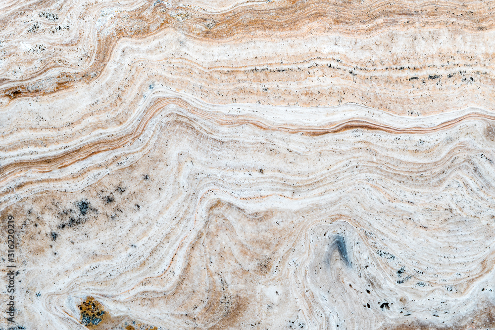 Smooth surface texture of stone, White beige or ecru color striped wave pattern of marble, Strong structure durable nature of rock for abstract background Smooth surface texture of stone, White beige or ecru color striped wave pattern of marble, Strong structure durable nature of rock for abstract background