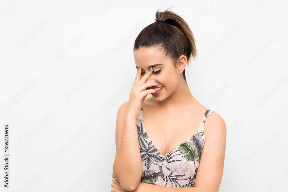 Young woman over isolated white background laughing Young woman over isolated white background laughing