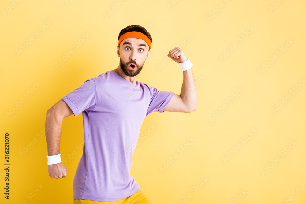 shocked bearded man running on yellow