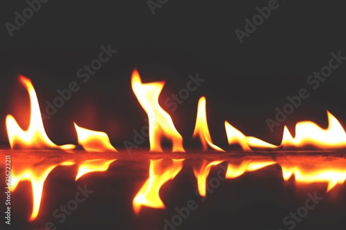 burning candles on black background