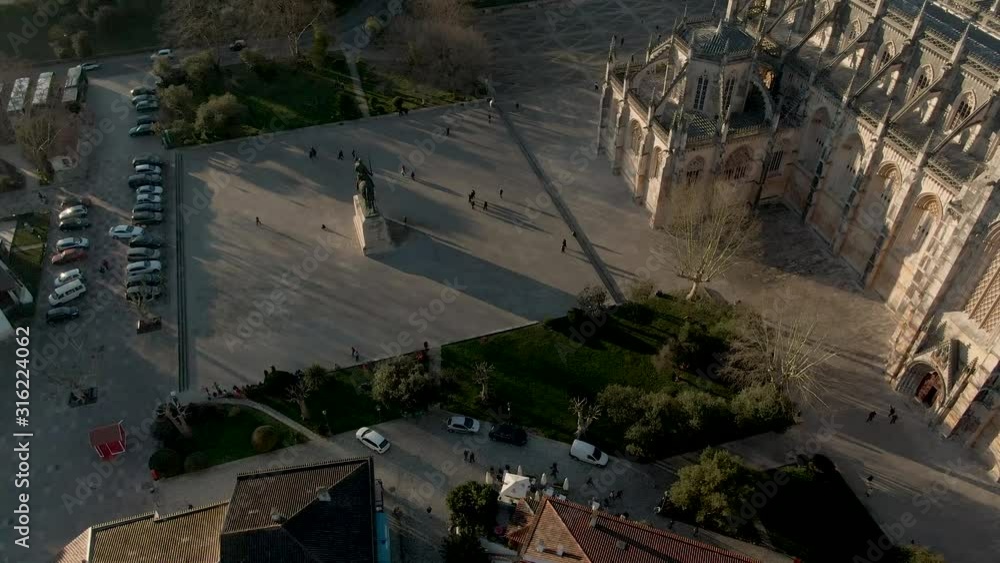 Large square in front of Monastery of Batalha in Portugal with the equestrian statue of general Nuno Álvares Pereira, aerial view Large square in front of Monastery of Batalha in Portugal with the equestrian statue of general Nuno Álvares Pereira, aerial view