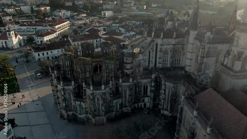 Imperfect Chapels of Monastery of Batalha in Portugal, octagonal structure with Gothic architecture and city panorama around seen from above