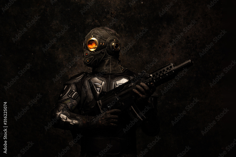 Portrait of a special forces soldier holding an assault rifle in his hands Portrait of a special forces soldier holding an assault rifle in his hands