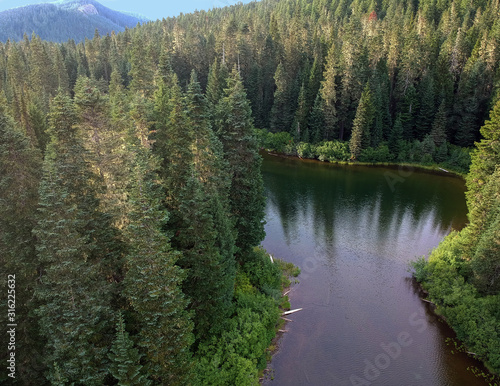Stunning Olallie Lake with the forest reflecting in the pristine water surrounded by the gifford pinchot national forest hidden in the green mountains of southern Washington State in Skamania County © Marc Sanchez
