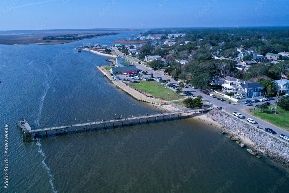 Aerial view of the town of Southport NC pier. Looking over the cape fear river at the city water front. Aerial view of the town of Southport NC pier. Looking over the cape fear river at the city water front.