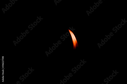  candle light burn against black background
