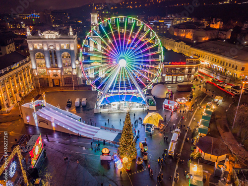 Aerial drone view. Ferris wheel in Kiev in the evening.