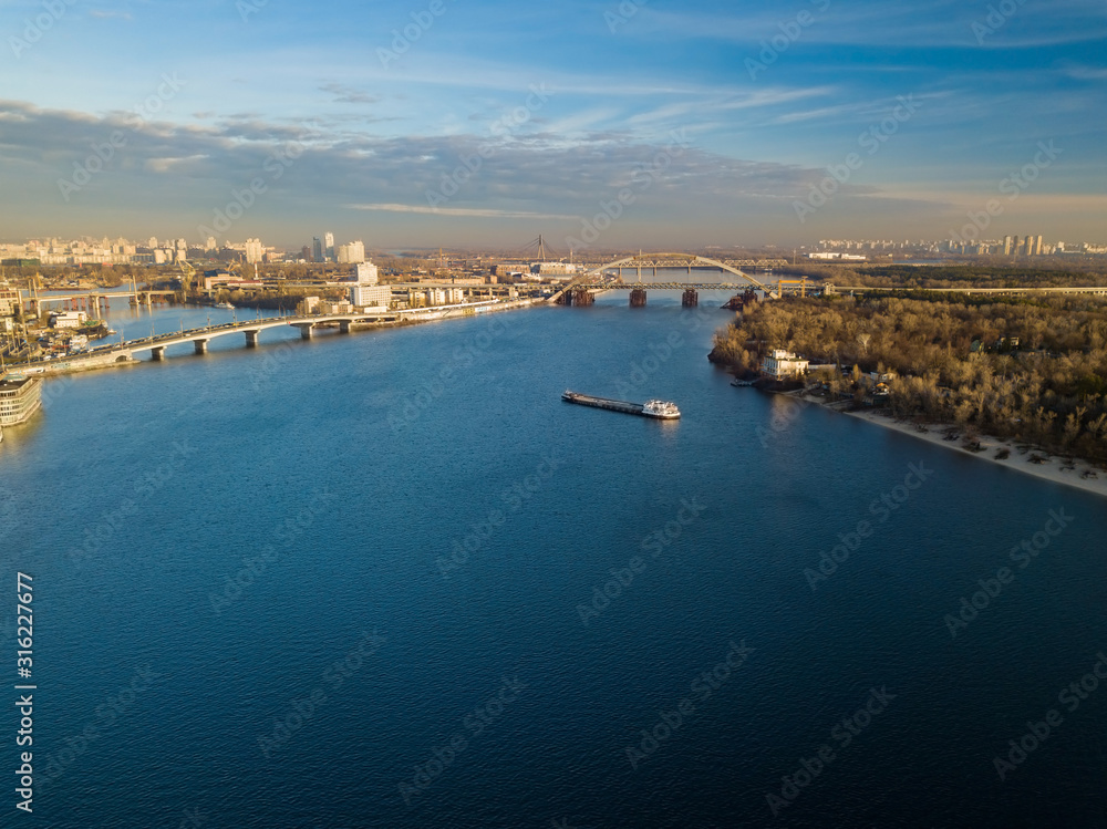 Aerial view. A barge is sailing along the Dnieper in Kiev.