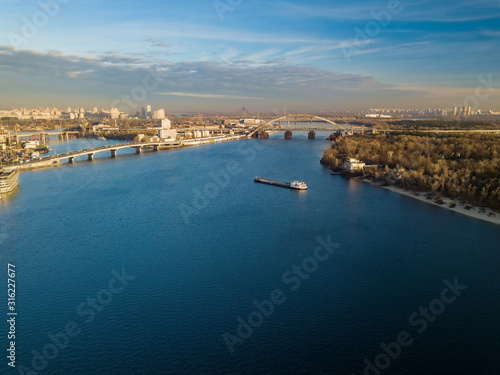 Aerial view. A barge is sailing along the Dnieper in Kiev.
