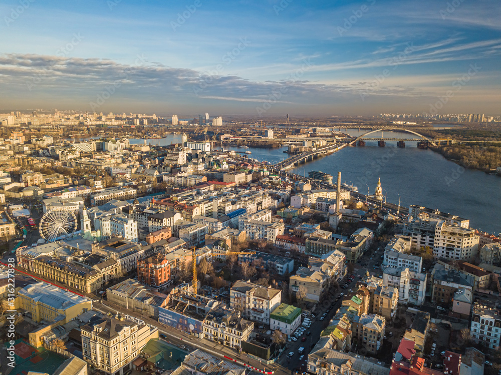 Aerial drone view. View of the Podil district in Kiev on a sunny morning.