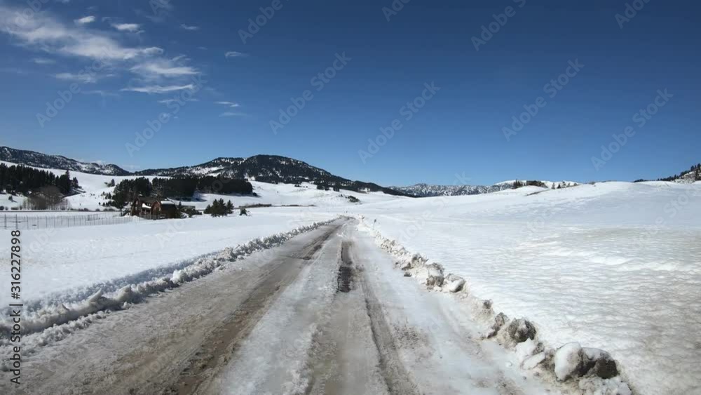 Driving on a small dirt road during winter Driving on a small dirt road during winter
