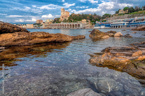 Obraz na plátně Tranquil rock pool with view to the waterfront