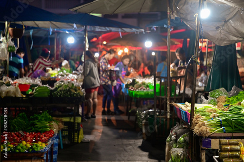 People buying fruit and vegetable in morning market for making breakfast or buying in bulk to resell at regional local in thailand © jes2uphoto