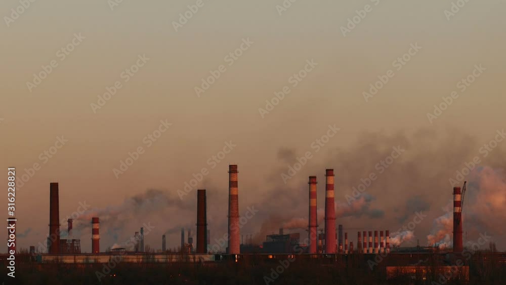 Chemical factory. Many chimneys emit toxic substances at sunset. Ecological problem. Gas, steam and smoke time lapse. Chemical factory. Many chimneys emit toxic substances at sunset. Ecological problem. Gas, steam and smoke time lapse.
