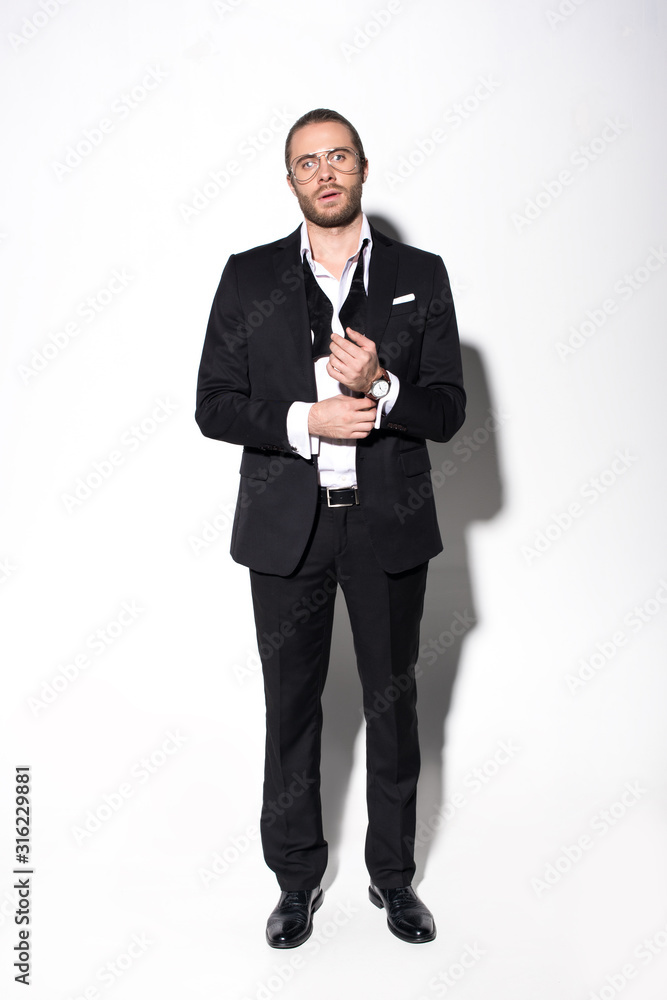 elegant handsome man in black suit on white elegant handsome man in black suit on white