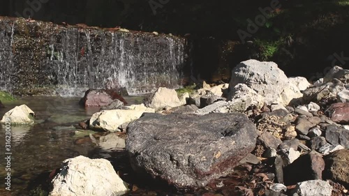  Waterfall in the dam surrounded by nature