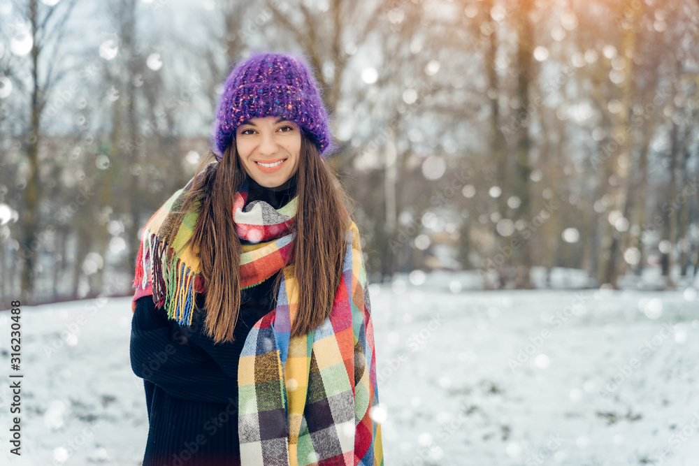 Winter young woman portrait. Beauty Joyful Model Girl laughing and having fun in winter park. Beautiful young female outdoors, Enjoying nature, wintertime Winter young woman portrait. Beauty Joyful Model Girl laughing and having fun in winter park. Beautiful young female outdoors, Enjoying nature, wintertime