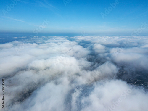 Aerial flight above clouds.